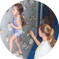 girl climbing wall